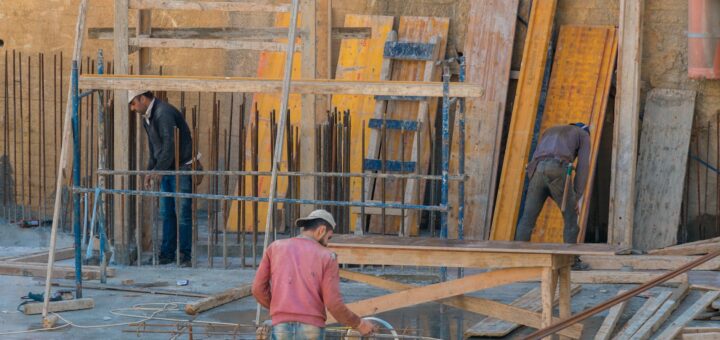 Men Working in a Building Under Construction