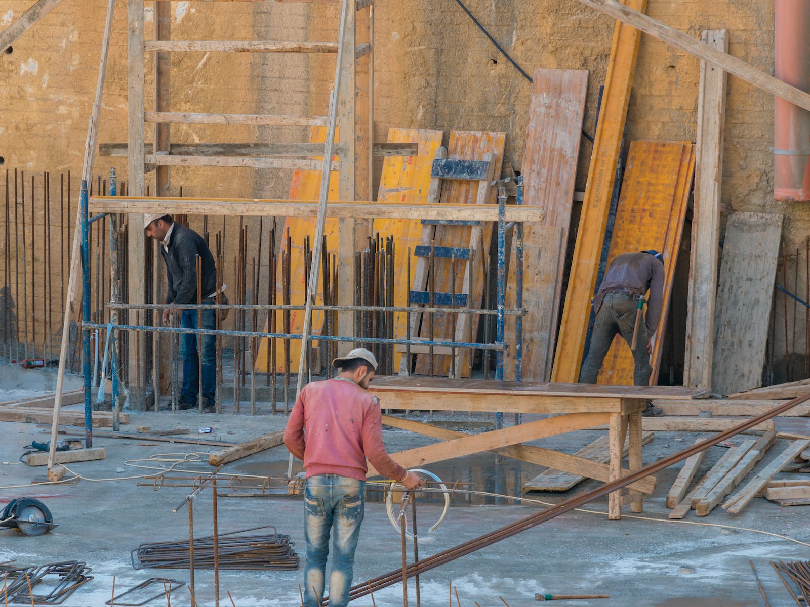 Men Working in a Building Under Construction