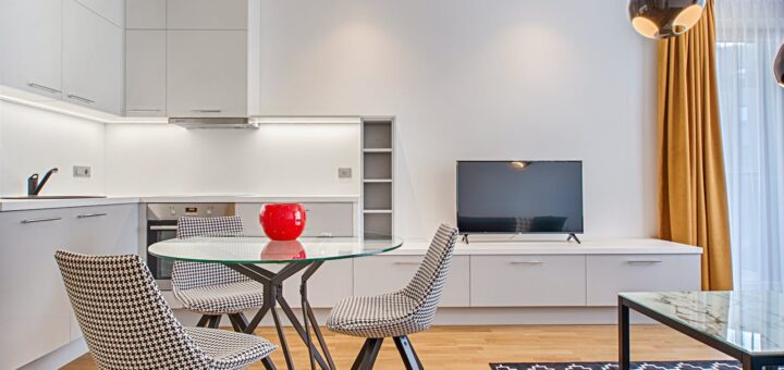 Clear Glass-top Table Near Flat Screen Television