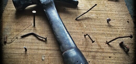 Black Claw Hammer on Brown Wooden Plank